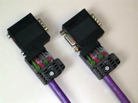 Close-up of a pair of vga cables

Description automatically generated